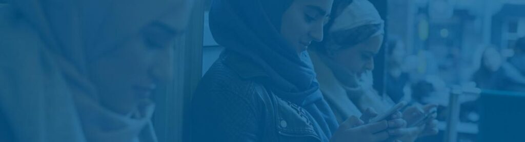 Women on bus holding cell phones with blue overlay