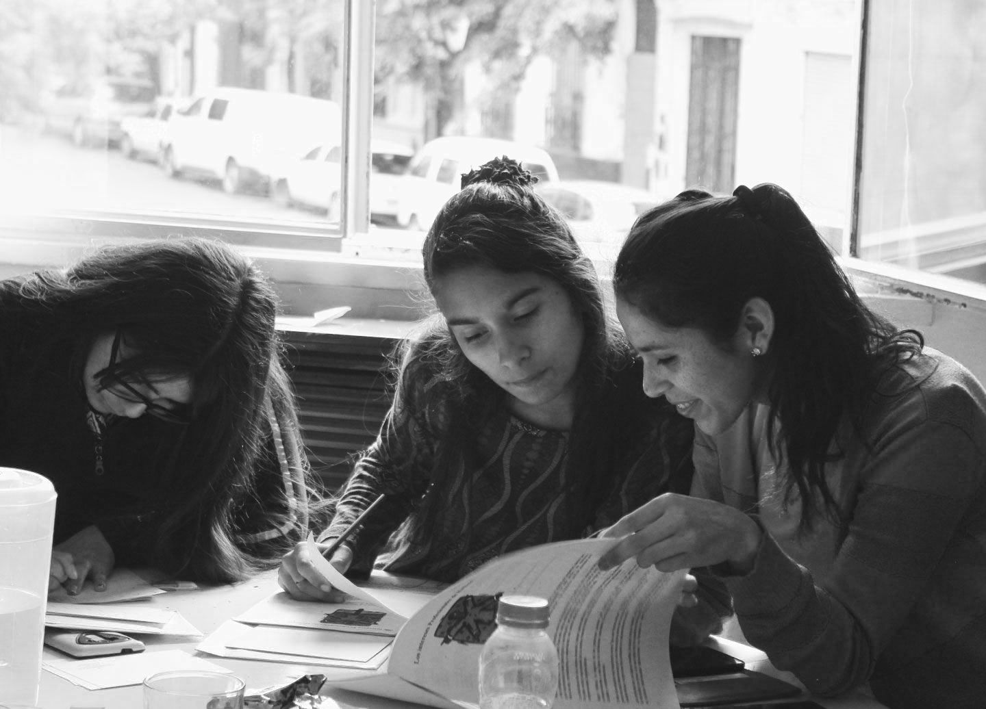 Puentes students working on an assignment