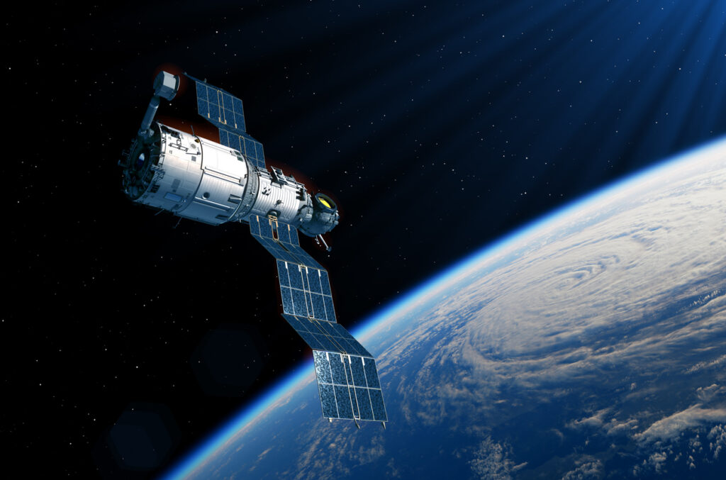 Space station deploys solar panels over planet Earth