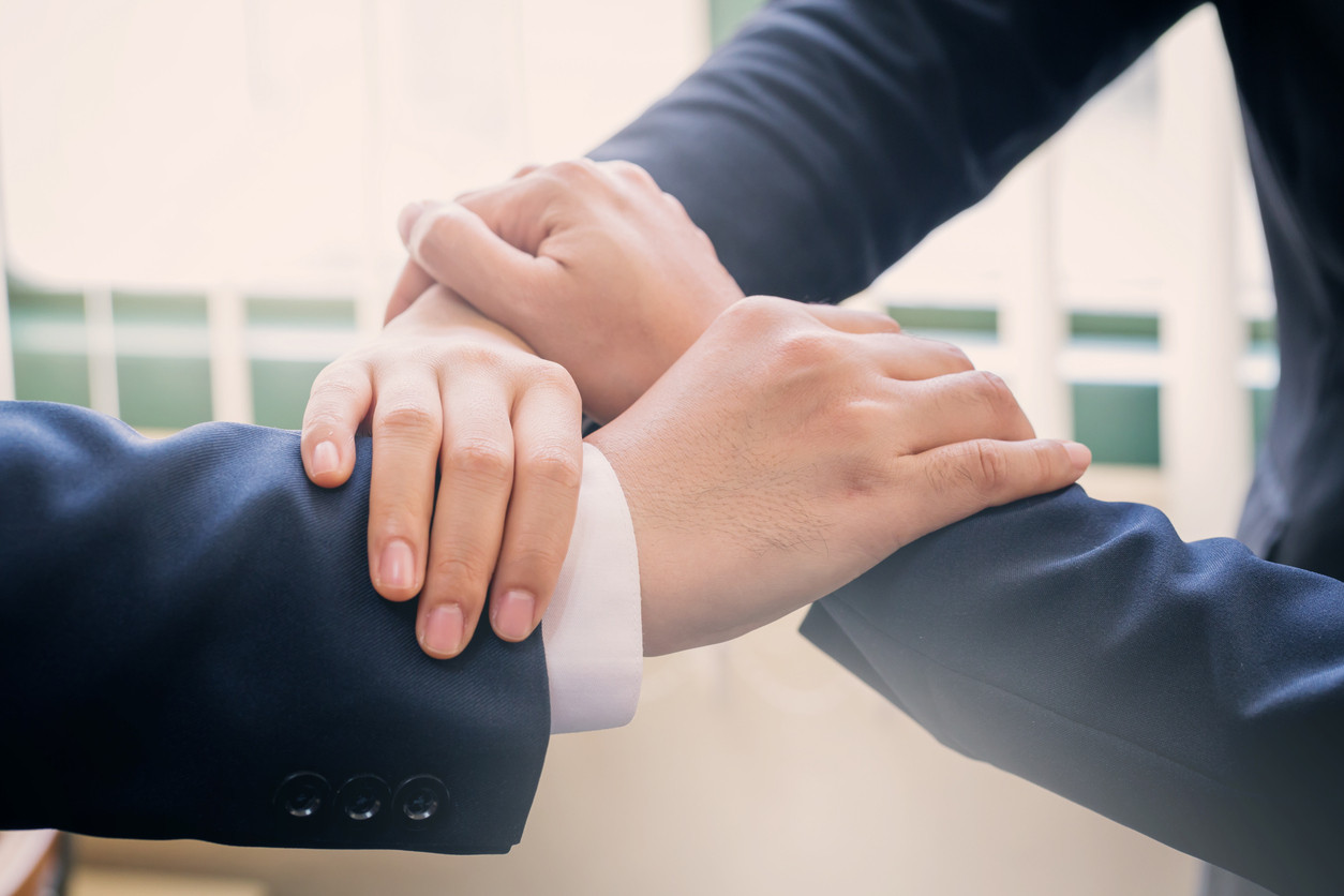 group of business man hands join together.